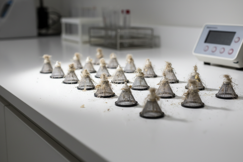 Electrostatic dust heads array trapping visible particles on white medical counter